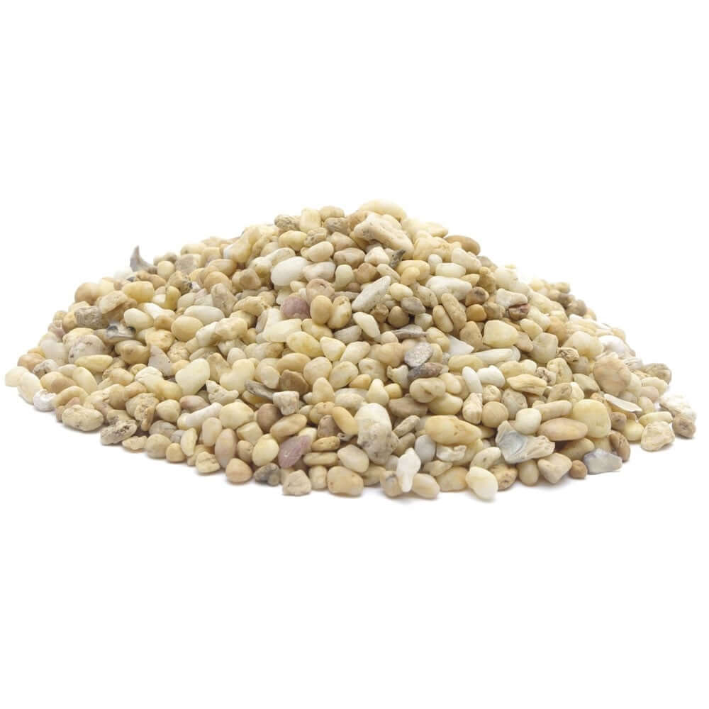 A pile of Marina Gravel Natural Desert Beige by Marina, small and round, on a white background.