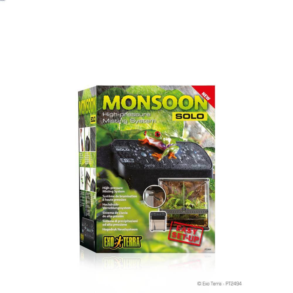 Exo Terra Monsoon Solo programmable misting unit with frog, terrarium, and setup instructions.