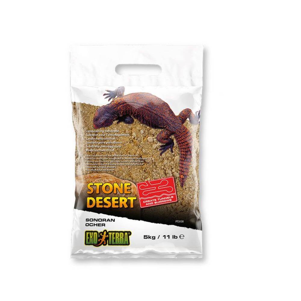 Exo Terra Ochre Stone Desert Substrate bag on a sandy background.