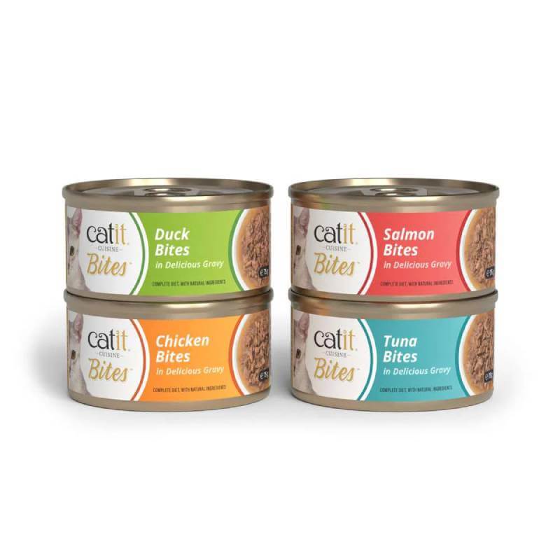 Four cans of Catit Cuisine Meaty Bites in Gravy: duck, chicken, salmon, &amp; tuna flavors stacked.