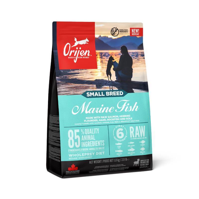 Orijen Small Breed Marine Fish dog food, with owner and pet by the water.
