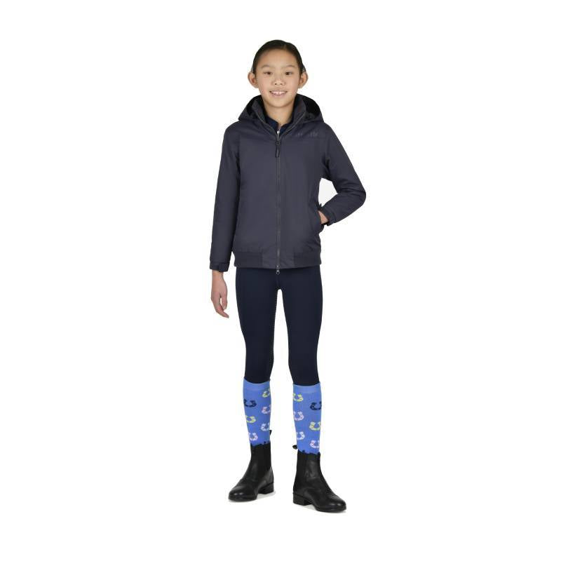 Smiling girl in Dublin Kids Trinity Blouson Jacket Navy Childs, navy leggings, and black boots.