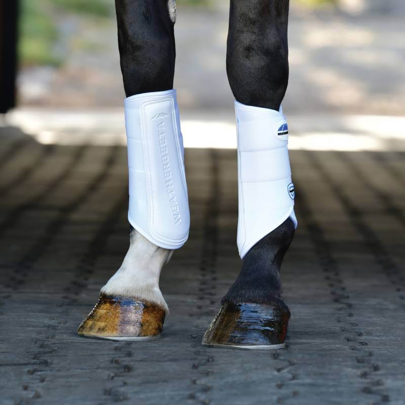 Close-up of Weatherbeeta Tough-Tec Prime Brushing Boots White/White on horse legs.