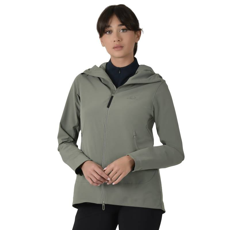 Woman wears a Weatherbeeta olive riding jacket, hands together against a white background.