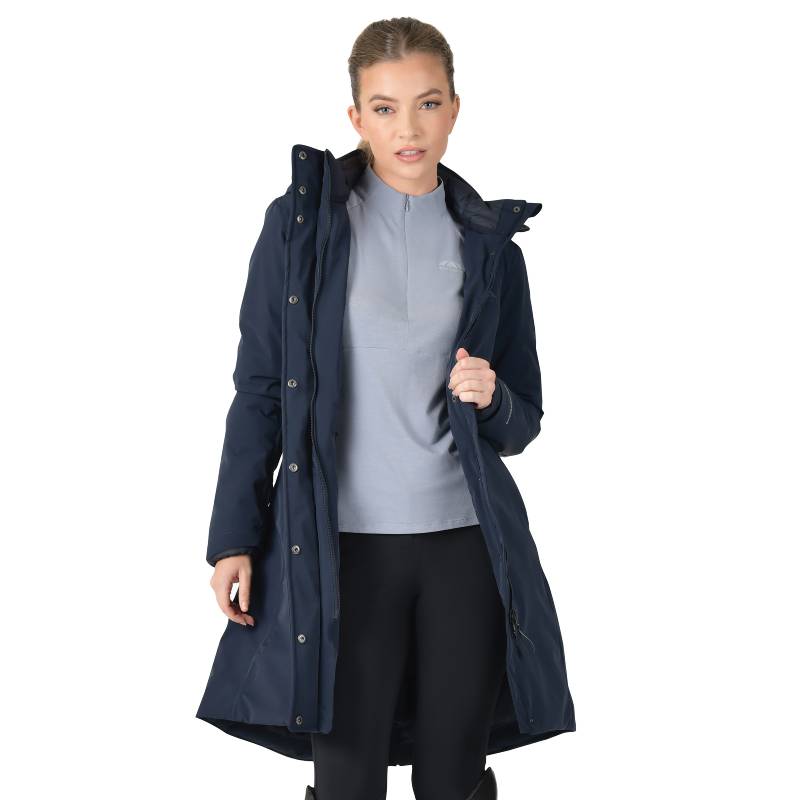 Woman in a Weatherbeeta navy waterproof longline equestrian jacket, facing forward.