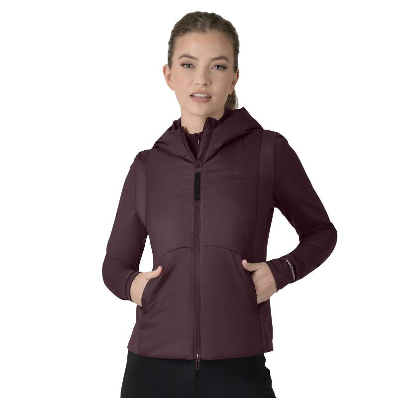 Woman in a mulberry Weatherbeeta Hybrid Padded Jacket with hands in pockets, facing forward.