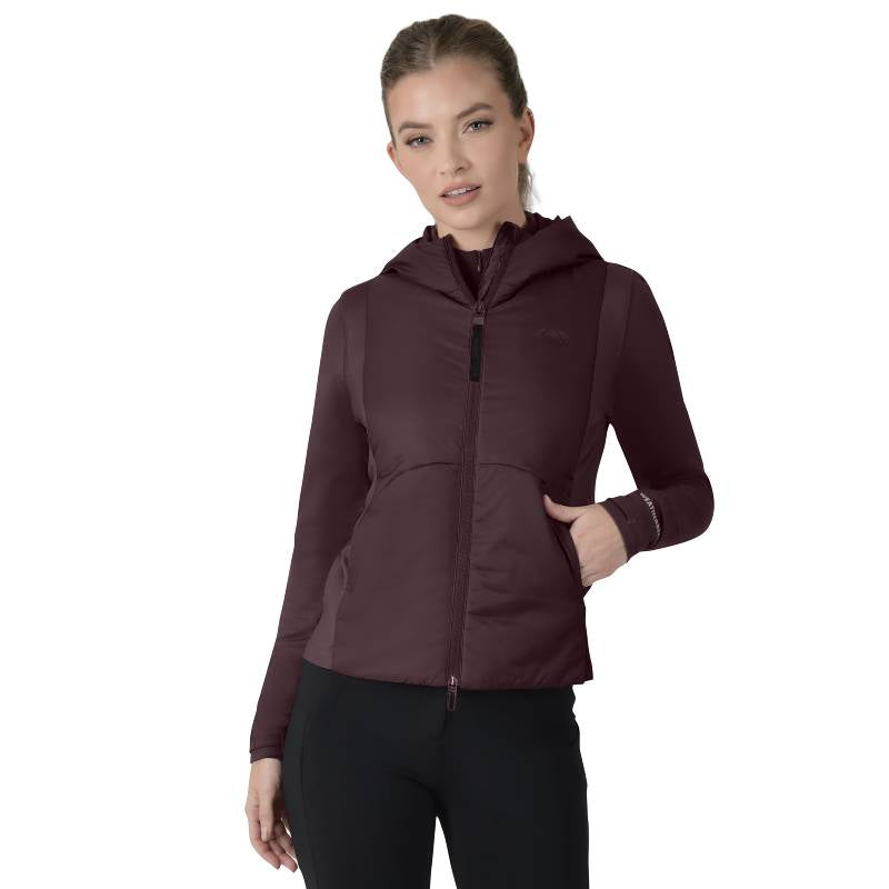 Woman in a Weatherbeeta Hybrid Padded Jacket Mulberry and black pants on a white background.