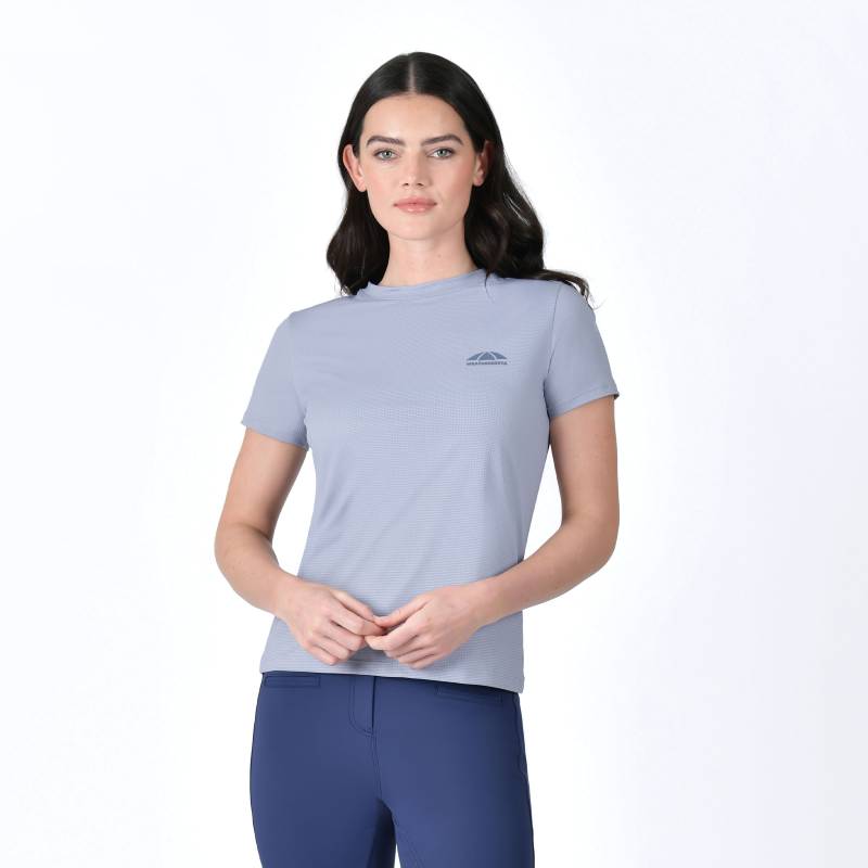 Woman in a Weatherbeeta Relaxed UV Short Sleeve Tee Blue Stone and blue leggings on white background.