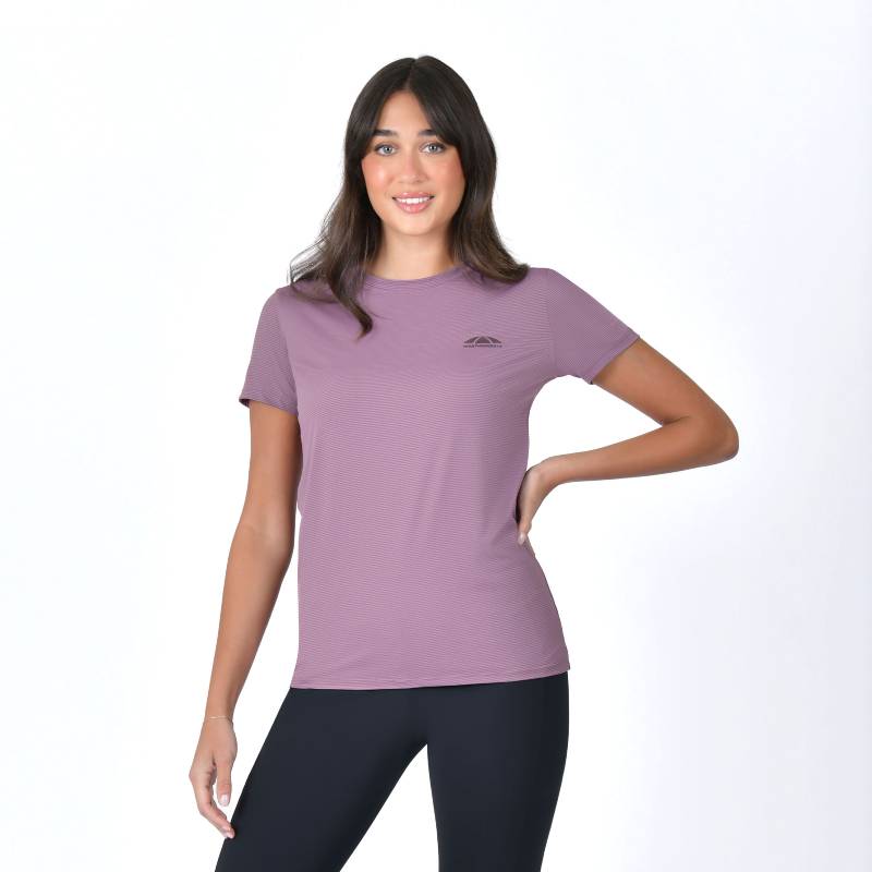 Woman poses, smiling, in a Weatherbeeta Relaxed UV Short Sleeve Tee Mauve Wine and black leggings.