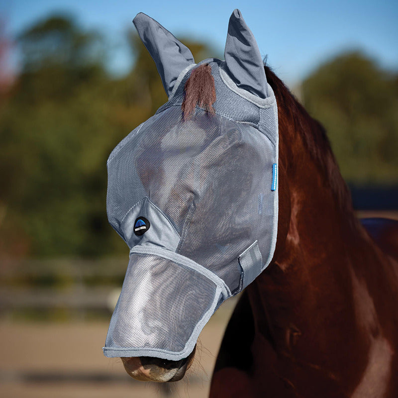Horse wearing the Weatherbeeta Comfitec Mesh Fly Mask with ears & nose for UV protection outside.