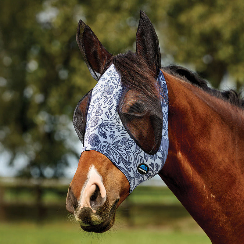 Weatherbeeta Comfitec Deluxe Stretch Fly Mask with Ears in White/Navy Floral on brown horse.