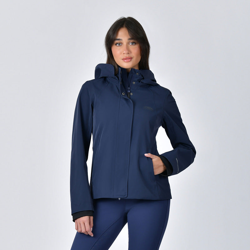 Woman in a Weatherbeeta Protect Waterproof Riding Jacket Navy, standing against a plain background.