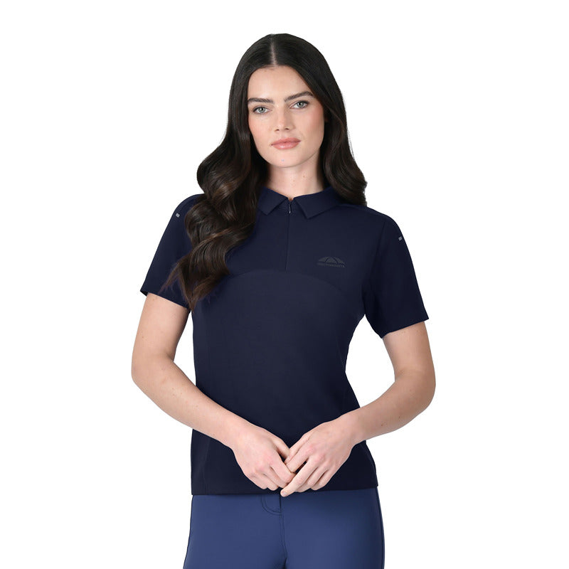 Woman wearing a Weatherbeeta 37.5 navy performance polo with UV protection stands against white.