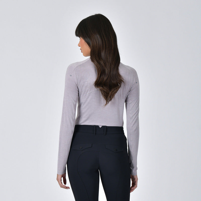 Woman with long brown hair wearing Weatherbeeta 1/4 Zip Top Mauve Wine Marle, facing away.