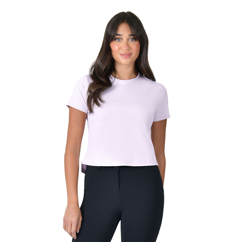 Woman in WeatherBeeta Relaxed Cropped UV Tee Lavender Mist, black pants, white background.