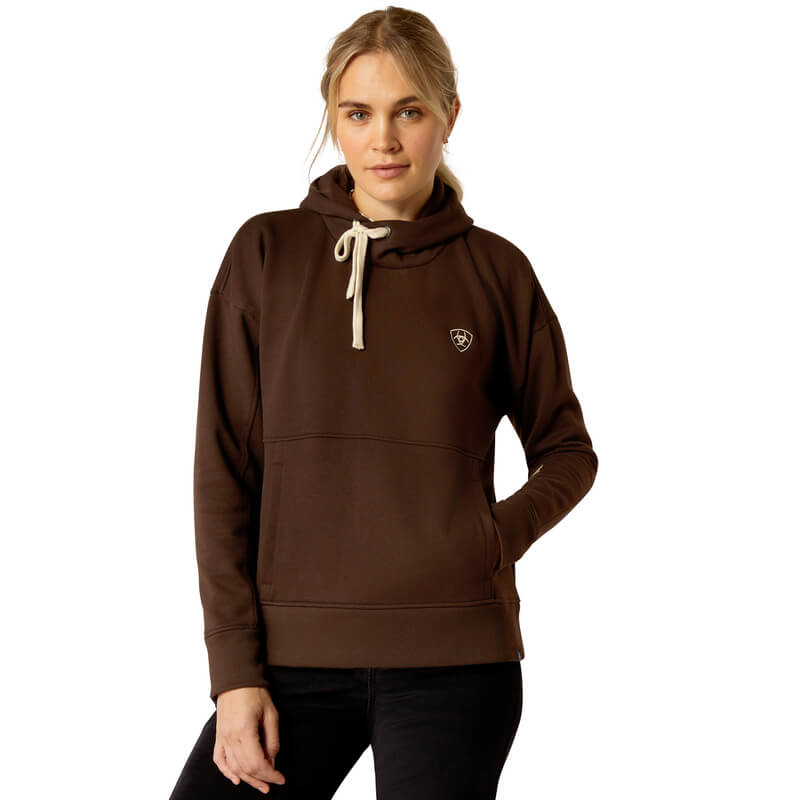 Woman wearing Ariat Womens Rabere Hoodie Mole with kangaroo pocket, one hand in her pocket.