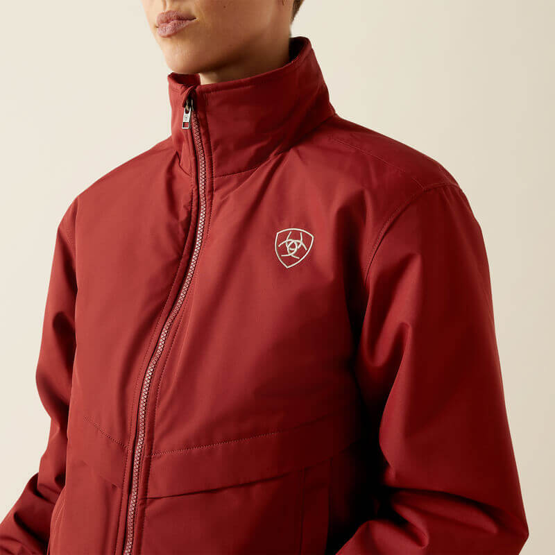 Person wearing a wind and water resistant Ariat Womens Stable 2.0 Insulated Jacket in Madder Brown.