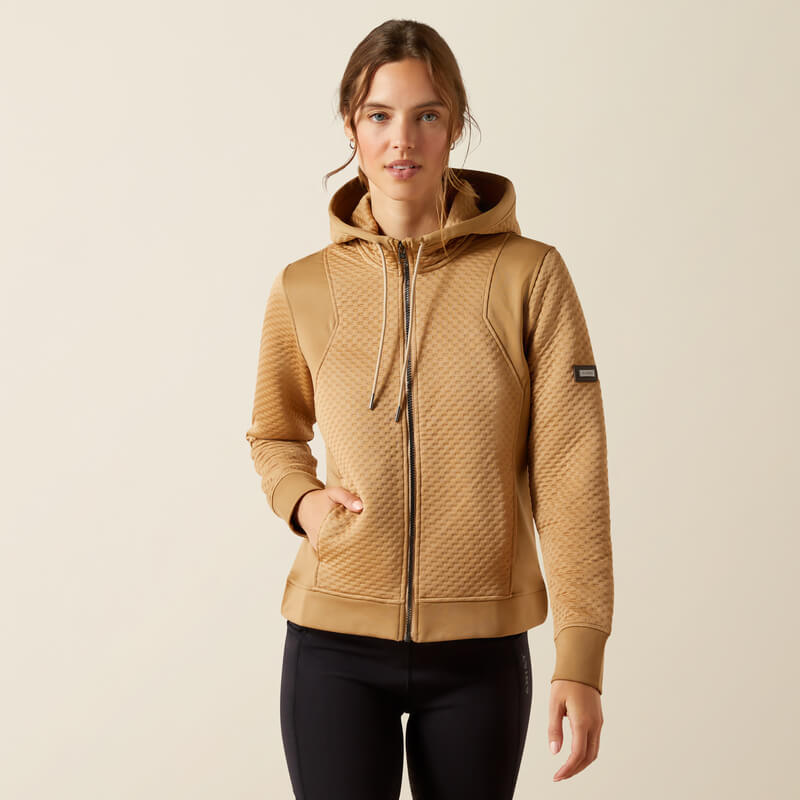 Woman in Ariat Womens Radiance Full Zip Tiger's Eye hoodie and black leggings.