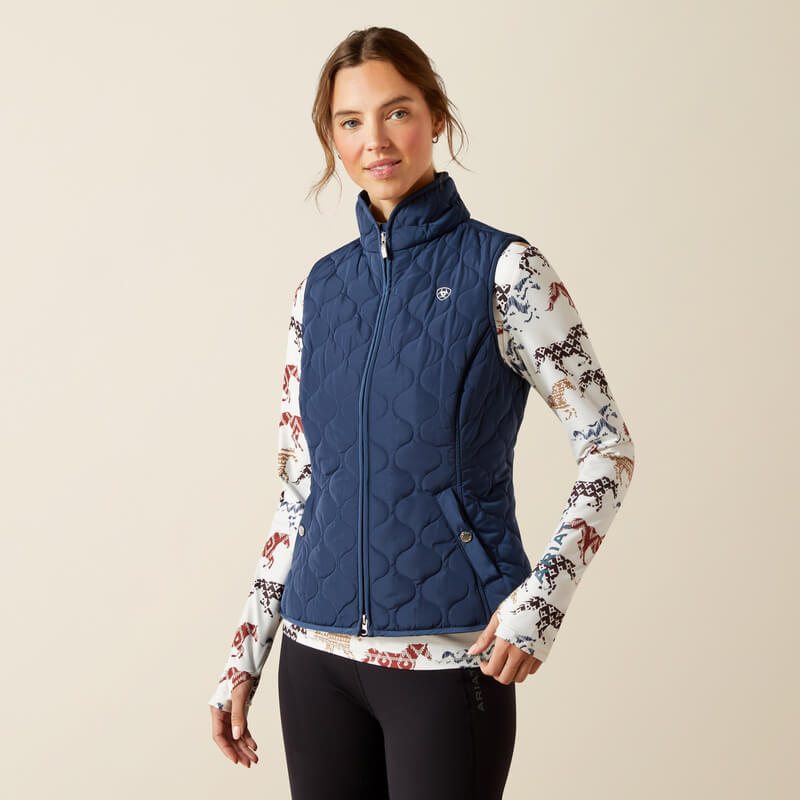 Woman in an Ariat Ashley 2.0 Insulated Vest Big Dipper, smiling confidently.