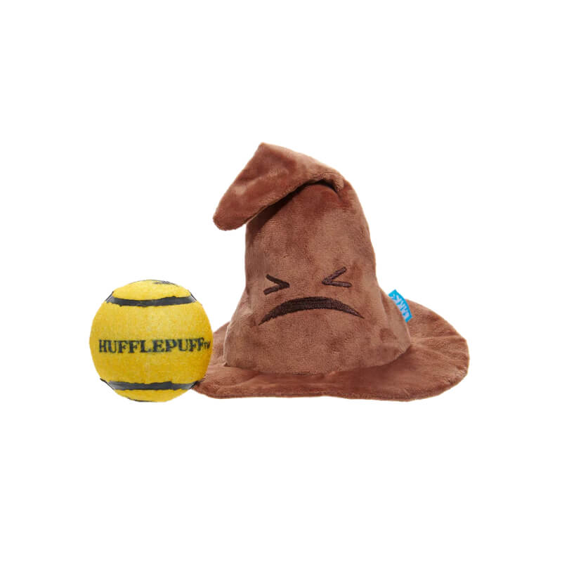 BARK Harry Potter Sorting Hat dog toy sits beside a red and yellow lion-patterned ball.