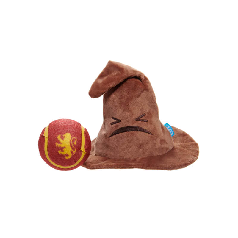 BARK Harry Potter Sorting Hat dog toy sits beside a red and yellow lion-patterned ball.