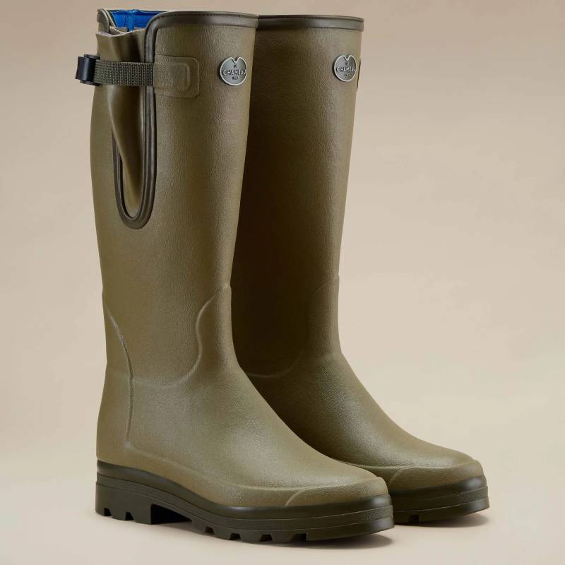 Le Chameau Vierzonord Men’s Wellingtons in olive green and black, set on a beige background.