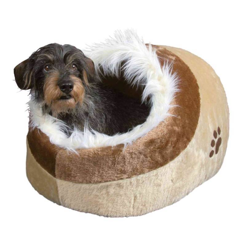Small dog relaxing in a Trixie Minou Dog Cave Beige & Brown by Trixie with a fluffy white rim.