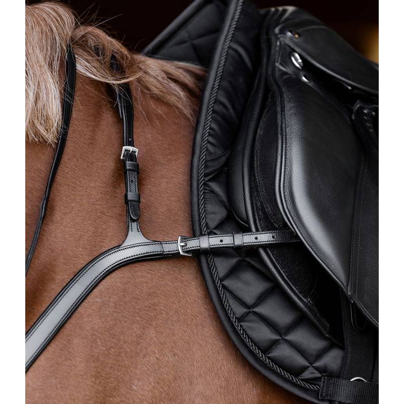 Close-up of Waldhausen X-Line Havana breastplate with long bridge on horse with black saddle.