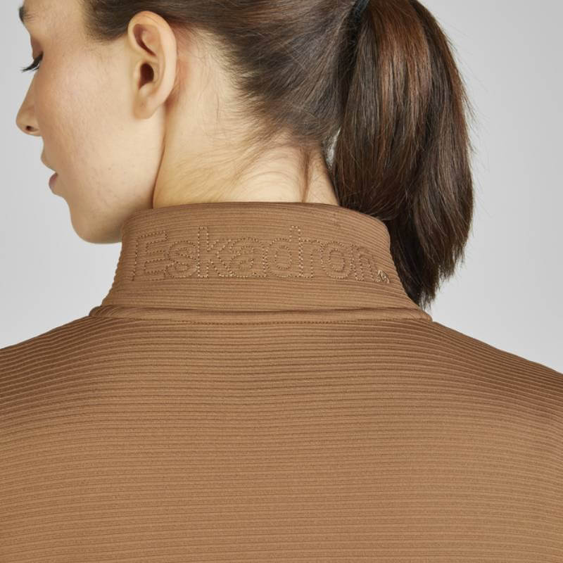 Woman with brown ponytail wears Eskadron Heritage Zip-Shirt Almond by Eskadron.