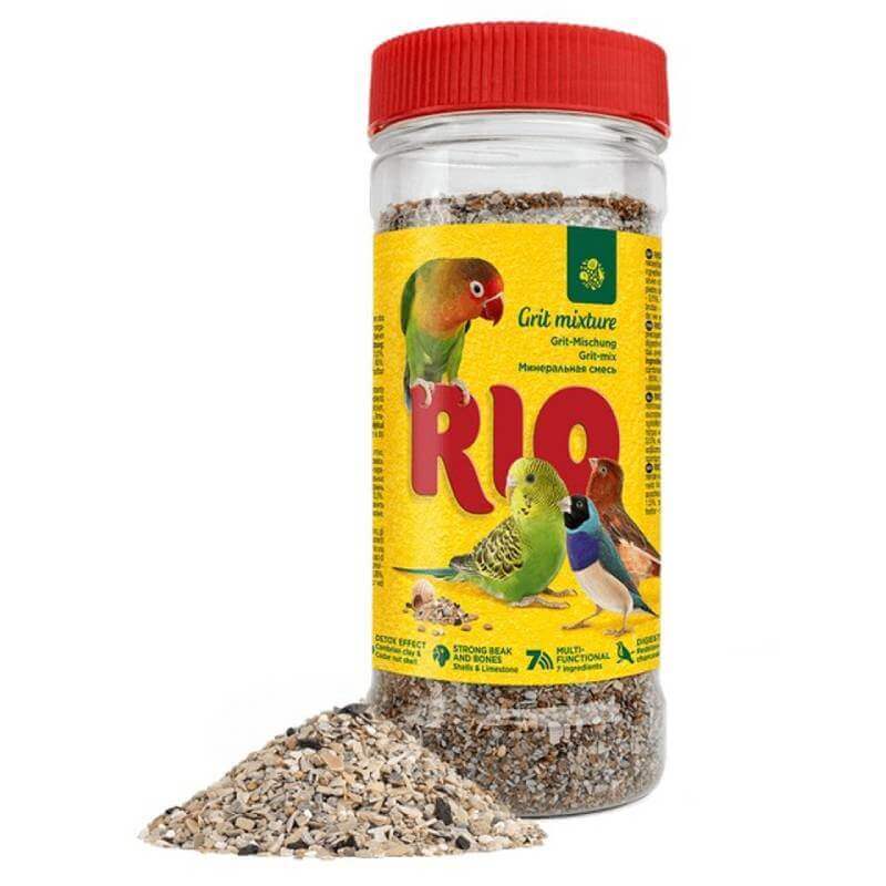 Rio Bird Grit 520g by Rio in clear container with yellow label; grit seen spilled nearby.