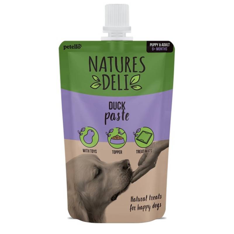 Natures Deli Duck Paste Pouch 100g—grain free treat, dog licking from hand.