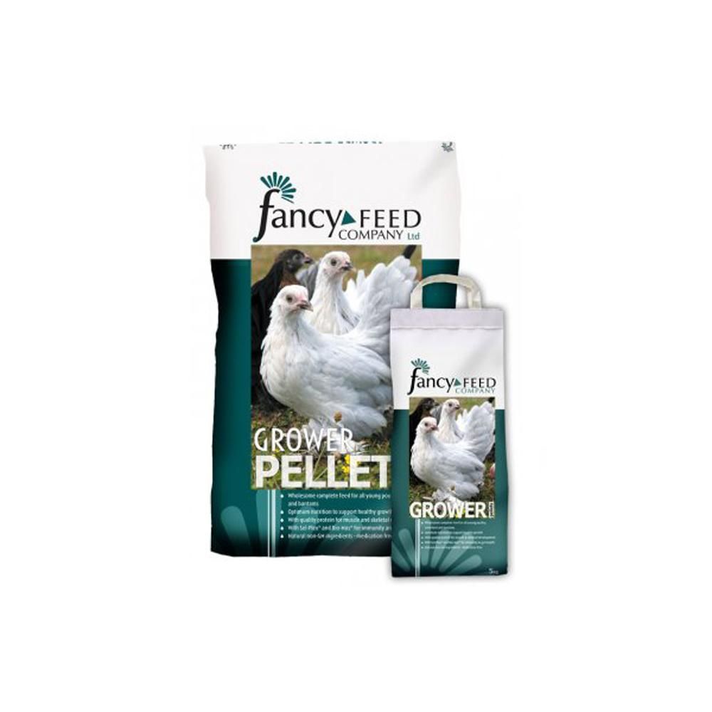 Two Fancy Feeds Grower Pellets bags for poultry with white chickens, balanced diet.