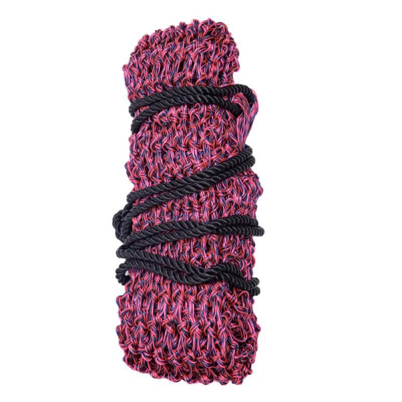 Hy Equestrian Slow Flow Haynet in navy/pink, rolled up and tied with a black rope.