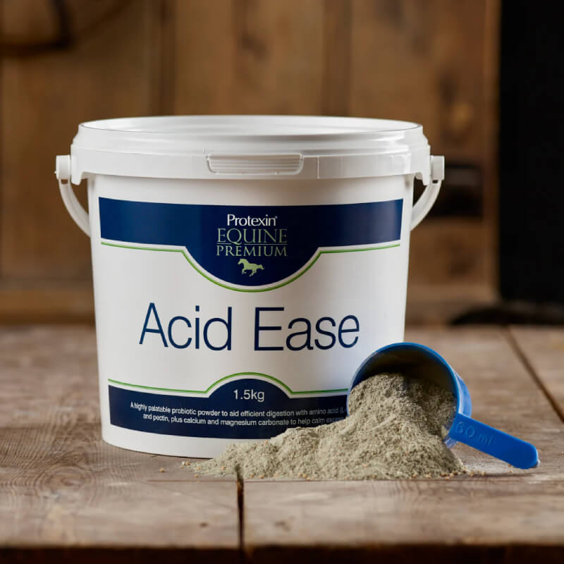 Protexin Acid Ease 1.5kg equine digestive supplement with blue scoop on wooden surface.