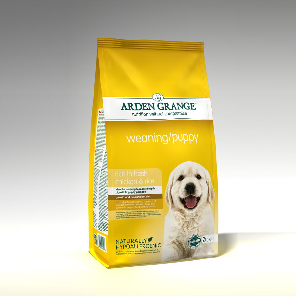 Yellow bag of Arden Grange Weaning Puppy kibble with a smiling puppy on the front.