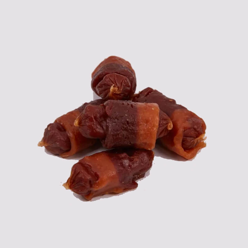 Tasty and Meaty Succulent Pigs In Blankets for Dogs 320g with fun cartoon dog illustration.