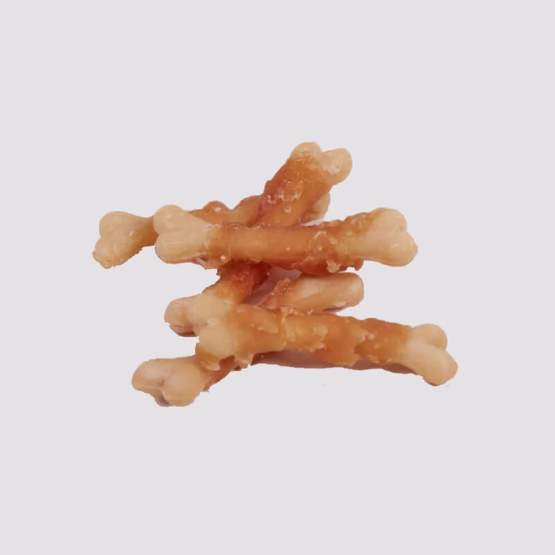 Five Tasty and Meaty Chicken & Calcium Bones for Dogs stacked on a plain light background.