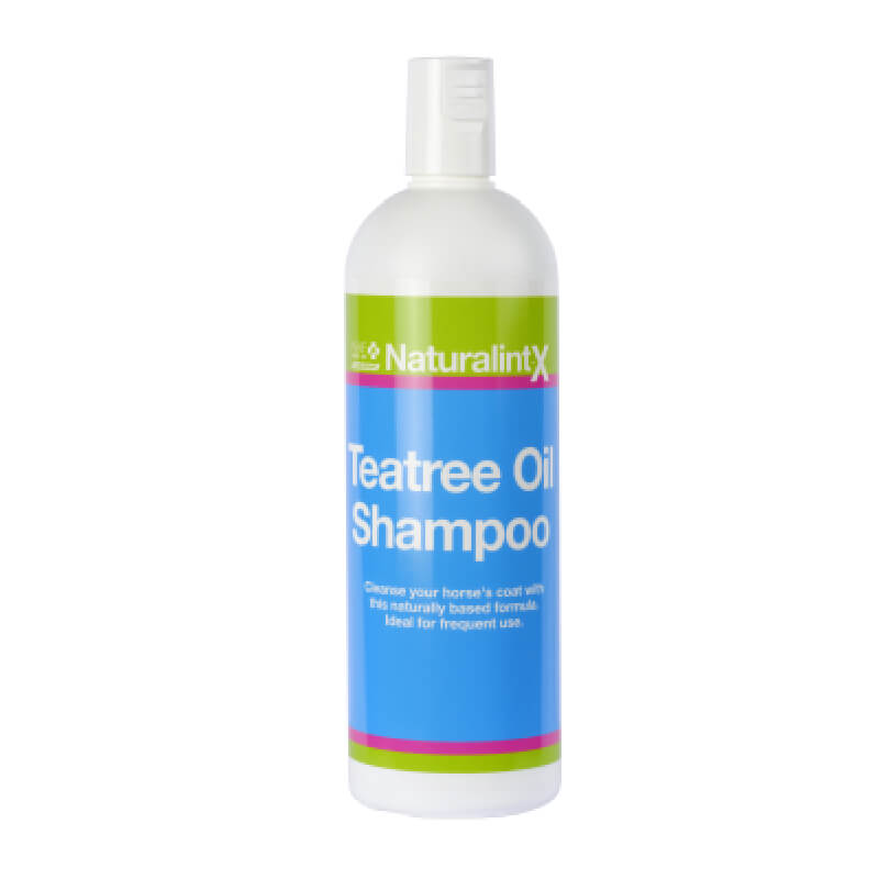 A white bottle of NAF Tea Tree Oil Shampoo with a blue label for horses' coats.
