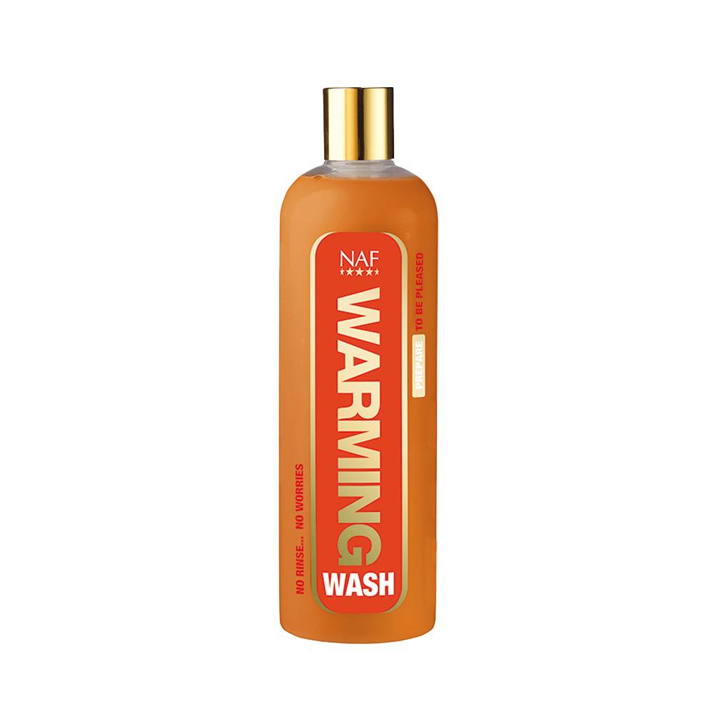 NAF Warming Wash 500ml, no rinse body wash in orange bottle with gold cap on white background.