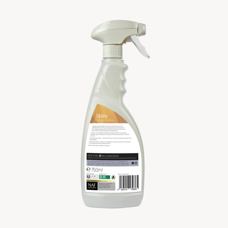 White NAF Shiny Coat Grooming Spray 750ml bottle with info and barcode on the back.