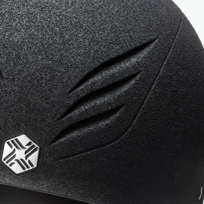 Close-up of EQx by Charles Owen Phoenix Jockey Skull Black/Silver with silver hexagon logo.