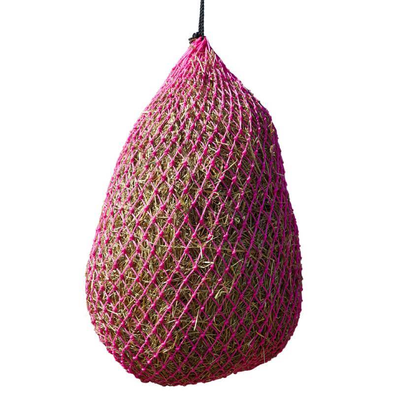 Elico Little Piggy Haynet: large pink mesh haynet for horses, filled with hay and hung by rope.