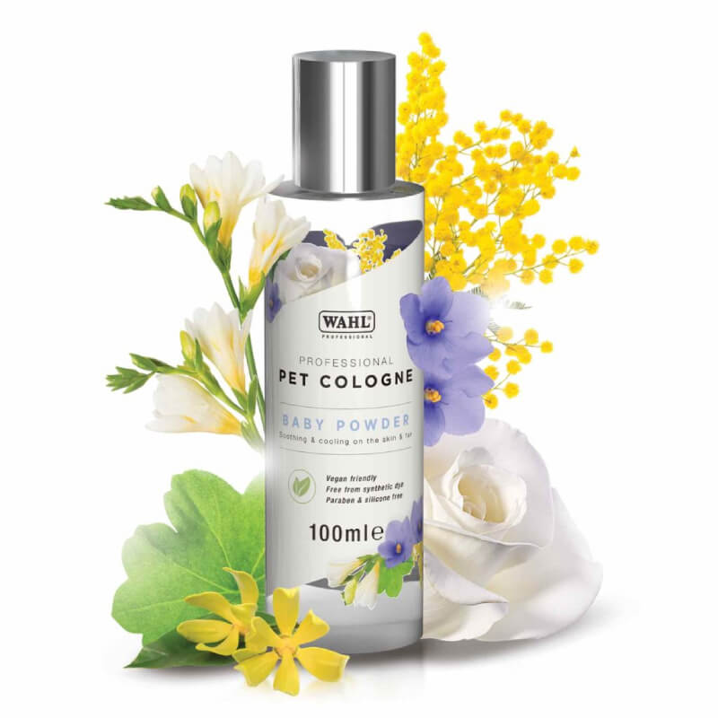 Wahl Pet Cologne Baby Powder bottle with floral design, surrounded by colorful flowers.