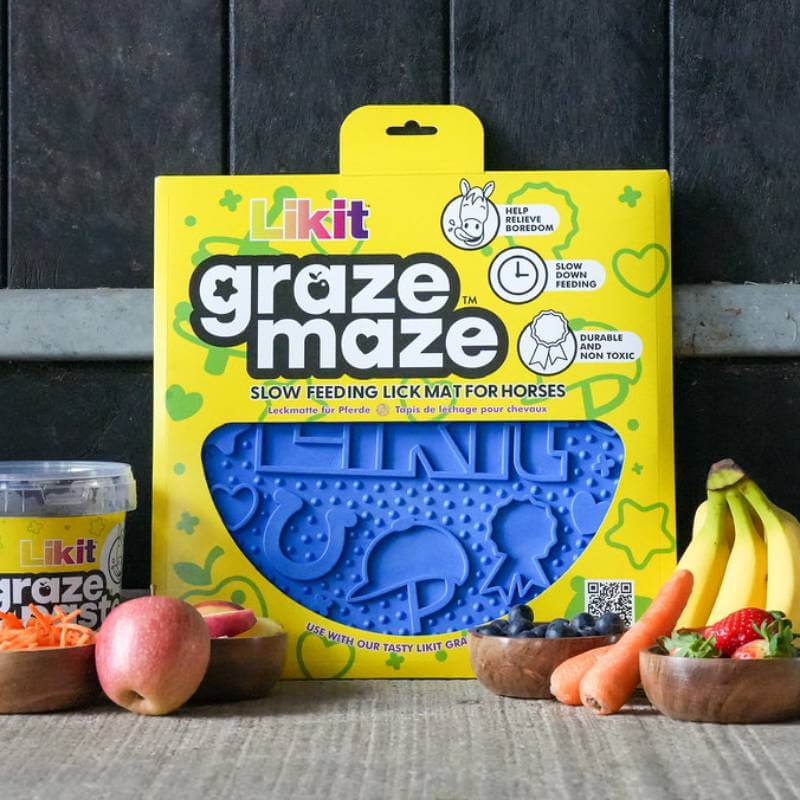 Likit Graze Maze Blue slow feeder lick mat by Likit, surrounded by fruit and vegetables.