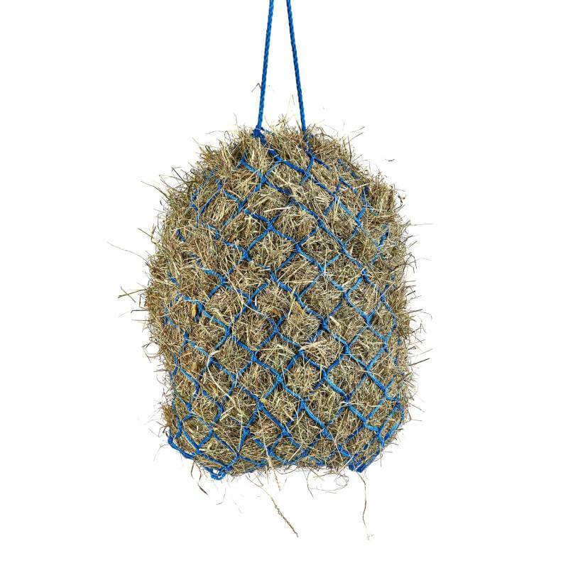 A blue Shires Haylage Net filled with hay hangs by two blue strings.