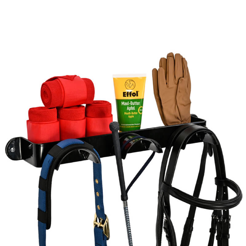 Stubbs Bridle Shelfie Black holds red wraps, brown gloves, horse balm, crop, and bridles.