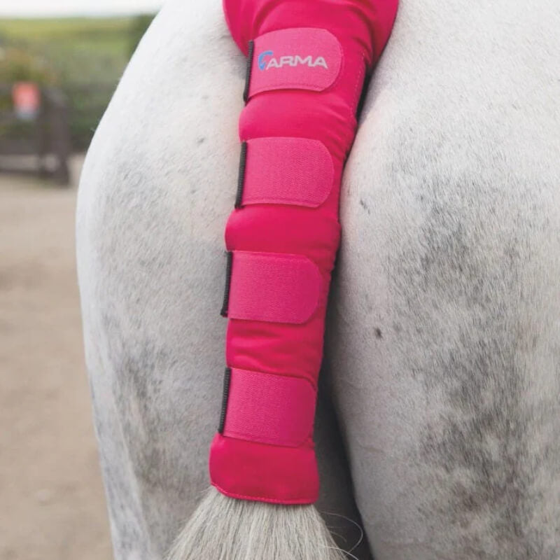 The Shires Arma Padded Tail Guard is a pink, Velcro-secured tail protector for horses.