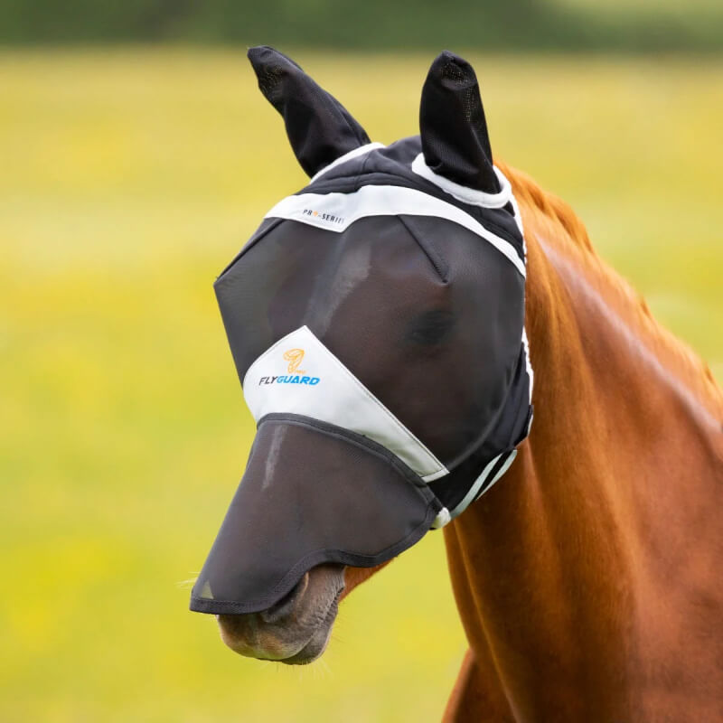 A horse wears the Shires FlyGuard Pro Fine Mesh Fly Mask with Ears &amp; Nose in black.