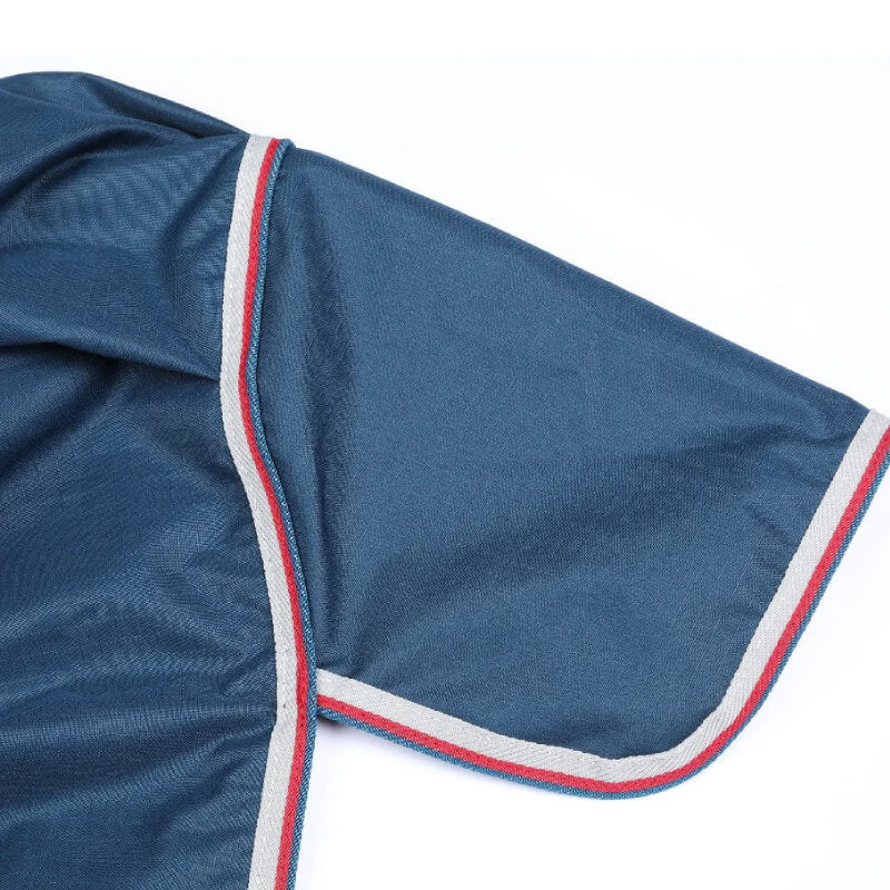 Shires Tempest Original Lite Turnout Rug in teal with grey/red trim, shown on white background.