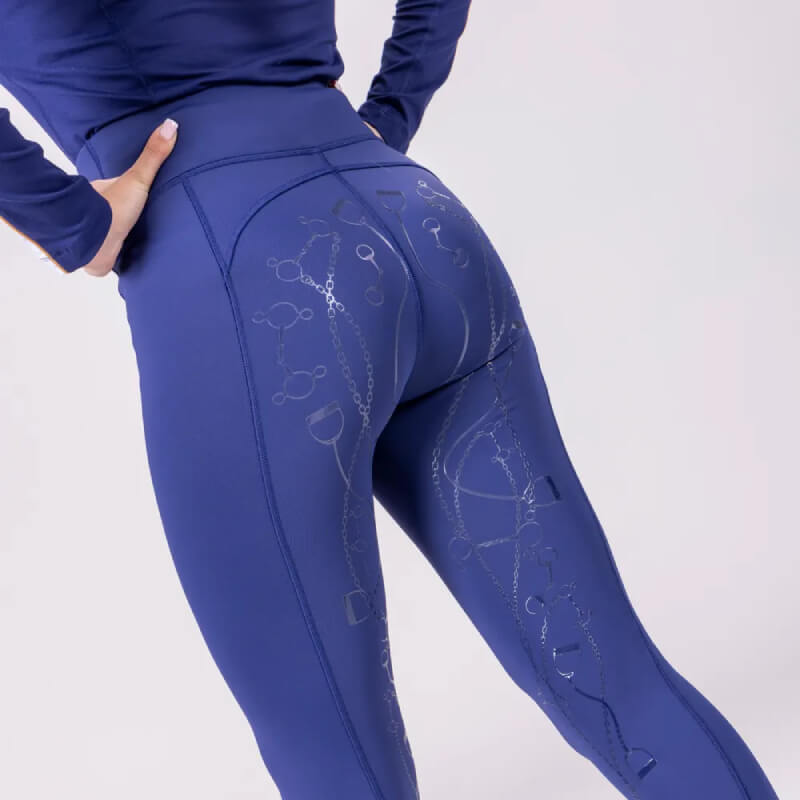 Person in Aubrion Team Winter Riding Tights Navy, equestrian style, hands on hips.